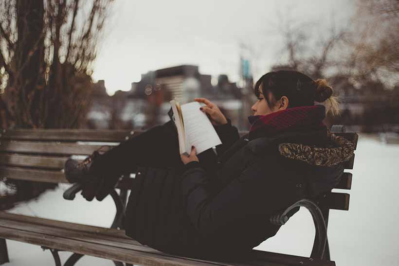 Girl reading a book to illustrate the answer to why is film music important